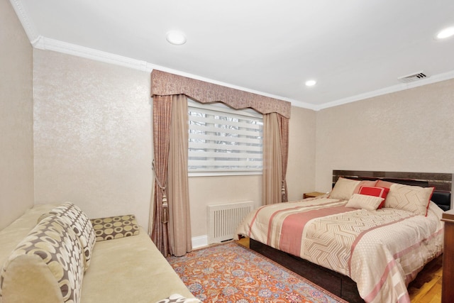 bedroom with visible vents, ornamental molding, and radiator heating unit