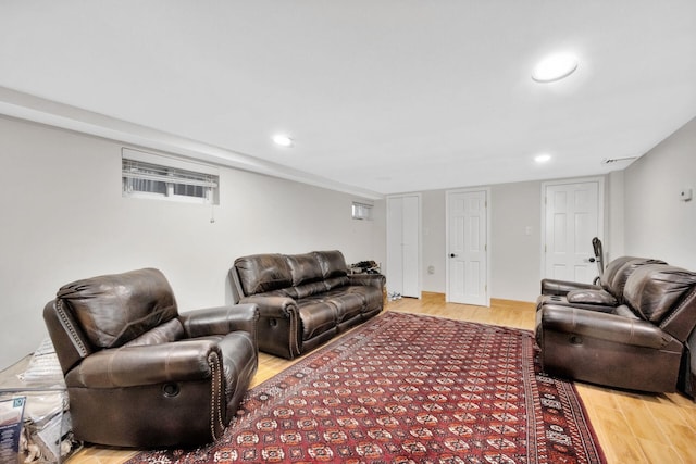 living area with recessed lighting and light wood-type flooring
