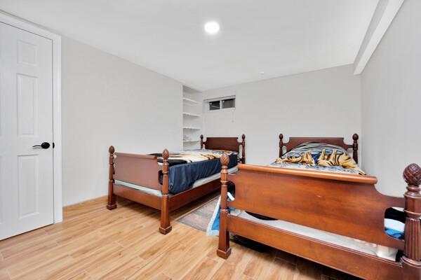 bedroom featuring recessed lighting and wood finished floors