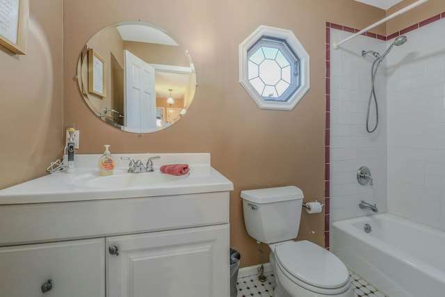 bathroom with toilet, vanity, and bathtub / shower combination