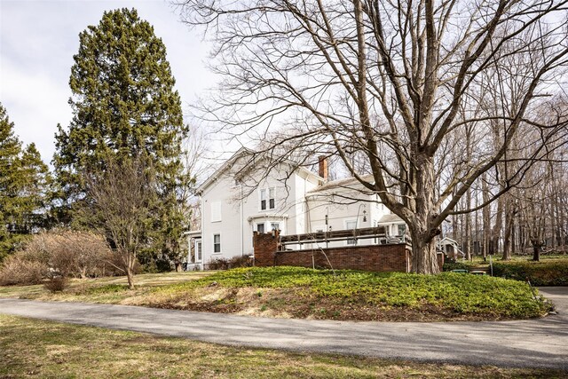 655 Vassar Rd, Poughkeepsie, NY 12603 - view of home's exterior with a chimney