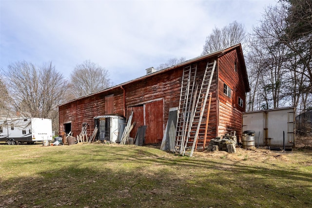 655 Vassar Rd, Poughkeepsie, NY 12603 - rear view of property featuring an outbuilding, an outdoor structure, and a lawn
