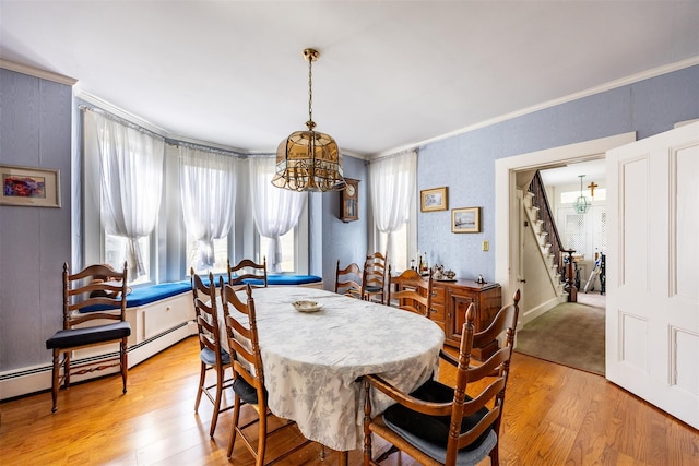655 Vassar Rd, Poughkeepsie, NY 12603 - dining space with light wood-type flooring, ornamental molding, stairway, a chandelier, and baseboard heating