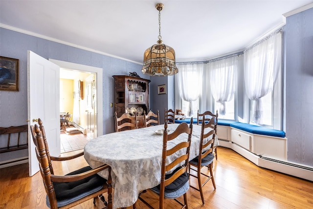 655 Vassar Rd, Poughkeepsie, NY 12603 - dining area featuring light wood finished floors, a notable chandelier, a baseboard radiator, and crown molding