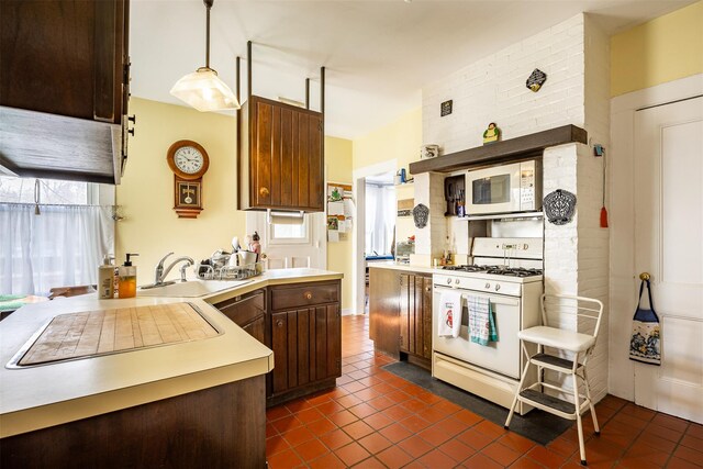 655 Vassar Rd, Poughkeepsie, NY 12603 - kitchen featuring a sink, light countertops, dark tile patterned floors, and white appliances