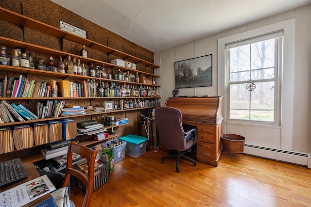 655 Vassar Rd, Poughkeepsie, NY 12603 - home office with a baseboard heating unit and wood finished floors