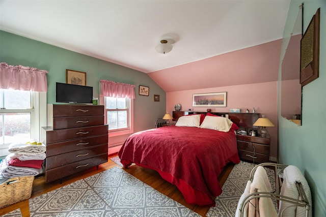 655 Vassar Rd, Poughkeepsie, NY 12603 - bedroom with baseboard heating, wood finished floors, and lofted ceiling