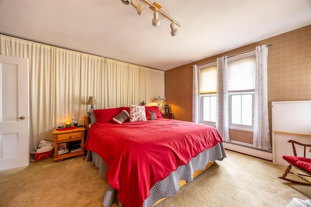 655 Vassar Rd, Poughkeepsie, NY 12603 - carpeted bedroom with a baseboard heating unit and wallpapered walls