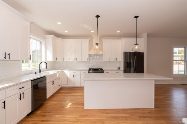 651 Vassar Rd, Poughkeepsie, NY 12603 - kitchen featuring stainless steel fridge with ice dispenser, a center island, dishwasher, a sink, and range