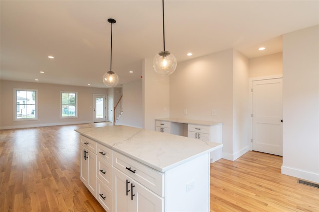 651 Vassar Rd, Poughkeepsie, NY 12603 - kitchen featuring hanging light fixtures, recessed lighting, a kitchen island, and light wood-style floors