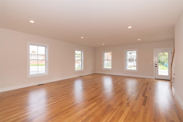 651 Vassar Rd, Poughkeepsie, NY 12603 - unfurnished room featuring light wood-style floors, a healthy amount of sunlight, and visible vents