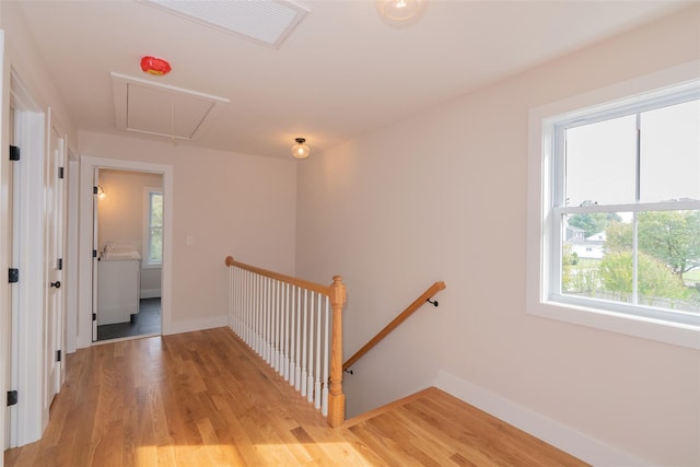 651 Vassar Rd, Poughkeepsie, NY 12603 - stairway featuring wood finished floors, attic access, baseboards, and visible vents