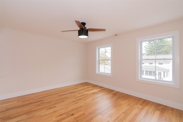 651 Vassar Rd, Poughkeepsie, NY 12603 - spare room with light wood-style flooring, a ceiling fan, and baseboards