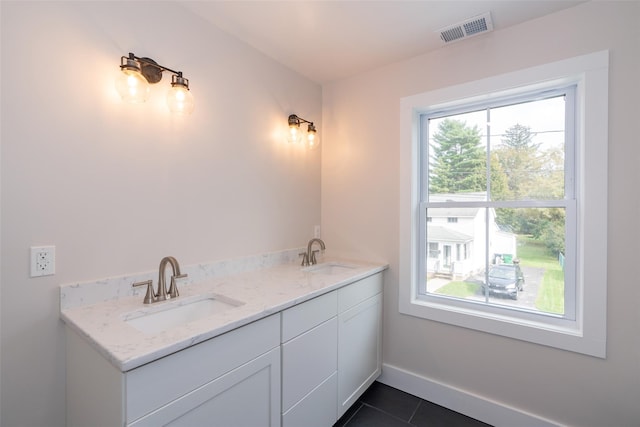 651 Vassar Rd, Poughkeepsie, NY 12603 - bathroom with baseboards, a sink, tile patterned flooring, and visible vents