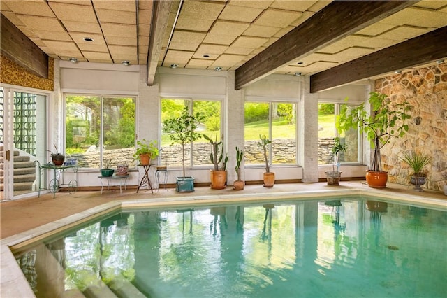 indoor pool with a patio area