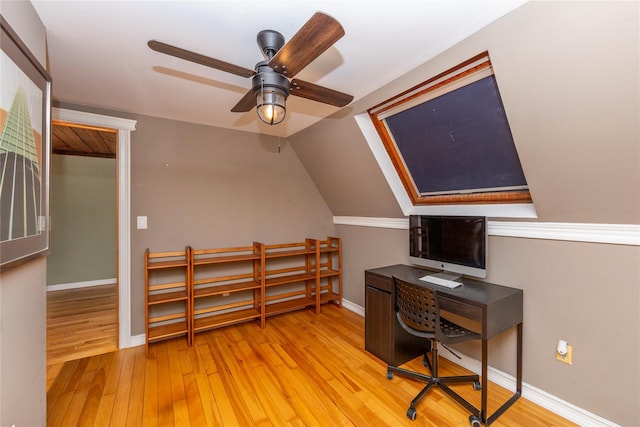 office space featuring wood-type flooring, baseboards, ceiling fan, and lofted ceiling