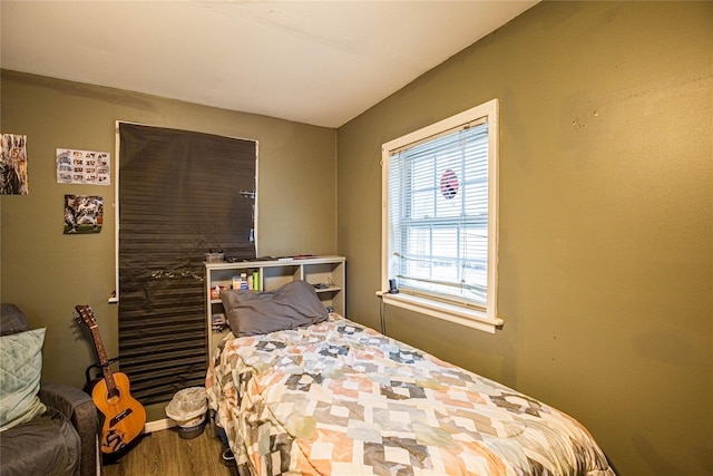 bedroom featuring wood finished floors
