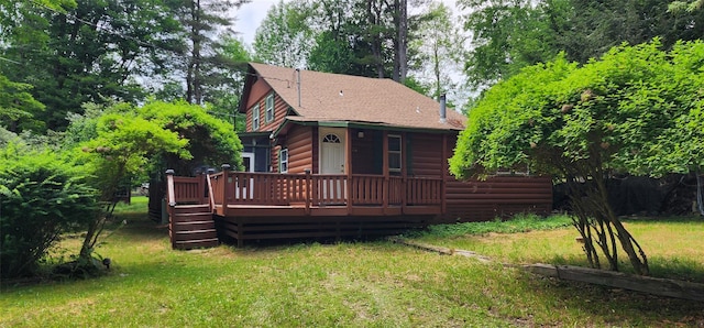 22 Ballard St, Smallwood, NY 12778 - back of house with faux log siding, a shingled roof, a wooden deck, and a yard