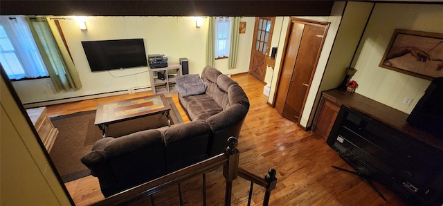 22 Ballard St, Smallwood, NY 12778 - living area with plenty of natural light, baseboard heating, and wood finished floors