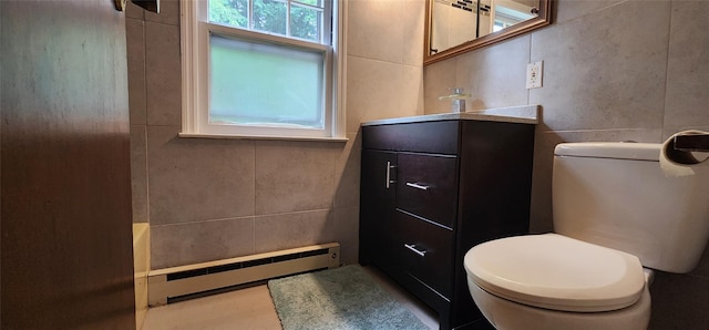 22 Ballard St, Smallwood, NY 12778 - bathroom featuring vanity, toilet, a baseboard heating unit, and tile walls