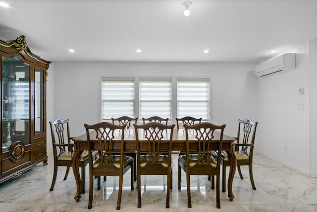 dining area featuring a wealth of natural light, marble finish floor, and a wall unit AC
