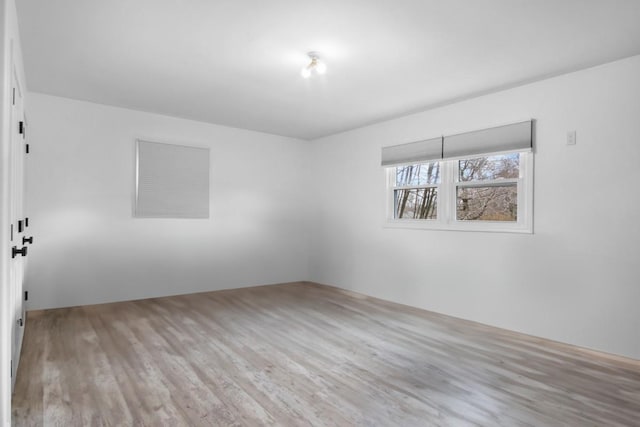 unfurnished room featuring wood finished floors