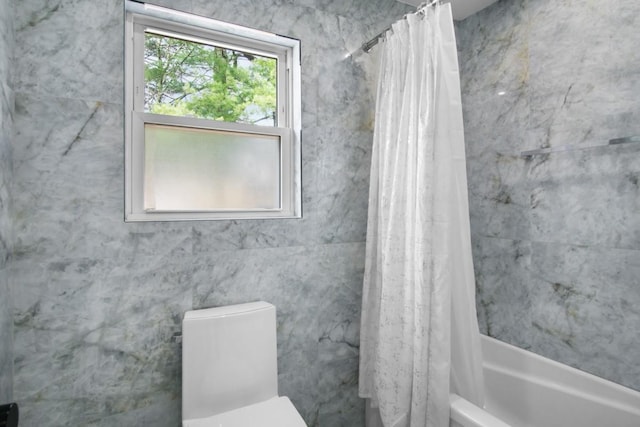 full bathroom with toilet and shower / bath combination with curtain