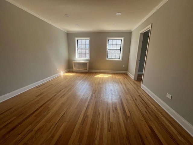 144-32 78th Ave Unit 3F, Flushing, NY 11367 - unfurnished room with wood finished floors, baseboards, and crown molding