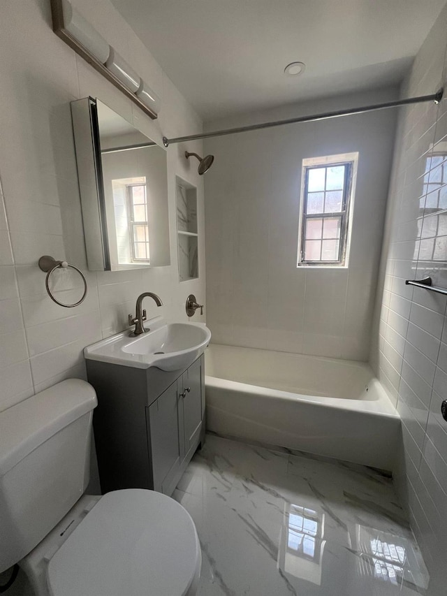 144-32 78th Ave Unit 3F, Flushing, NY 11367 - bathroom featuring toilet, vanity, shower / bathtub combination, marble finish floors, and tile walls