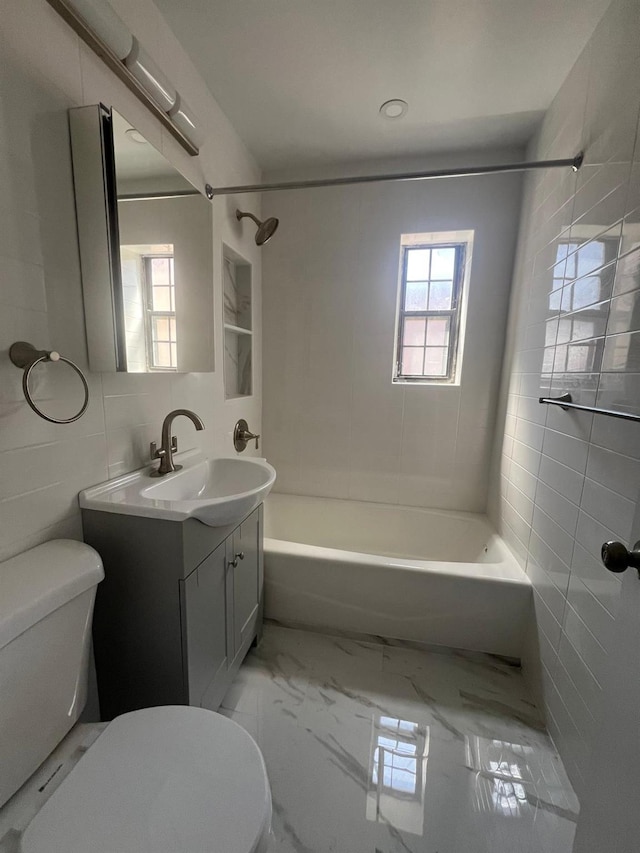 144-32 78th Ave Unit 3F, Flushing, NY 11367 - bathroom featuring toilet, vanity, bathtub / shower combination, marble finish floors, and tile walls