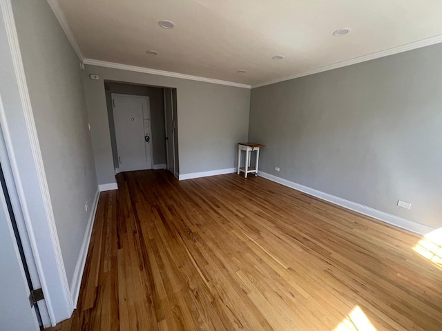 144-32 78th Ave Unit 3F, Flushing, NY 11367 - empty room with wood finished floors, ornamental molding, and baseboards