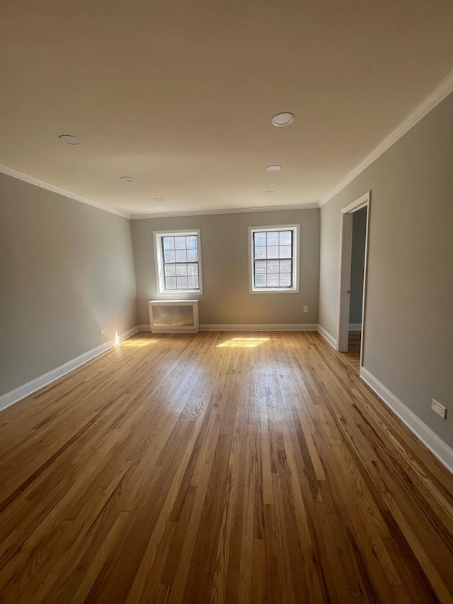 144-32 78th Ave Unit 3F, Flushing, NY 11367 - empty room with crown molding, baseboards, and wood finished floors