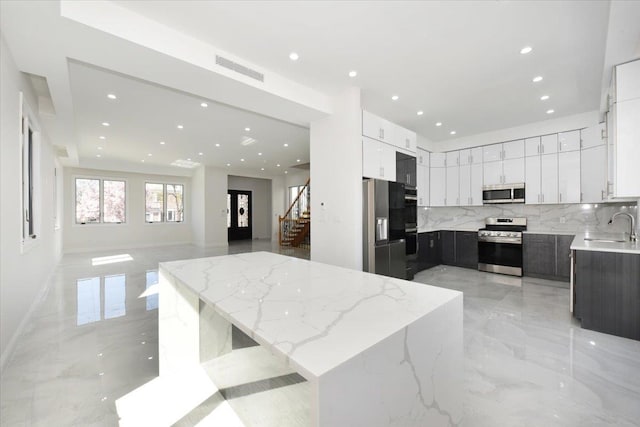 76-47 173rd St, Fresh Meadows, NY 11366 - kitchen with visible vents, marble finish floor, a sink, and appliances with stainless steel finishes