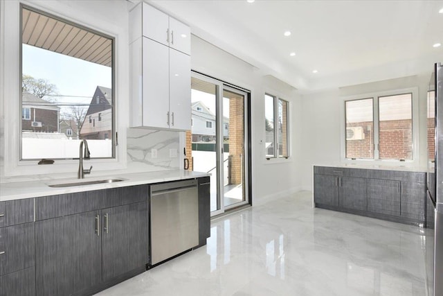 76-47 173rd St, Fresh Meadows, NY 11366 - kitchen featuring white cabinets, dishwasher, light countertops, and a sink