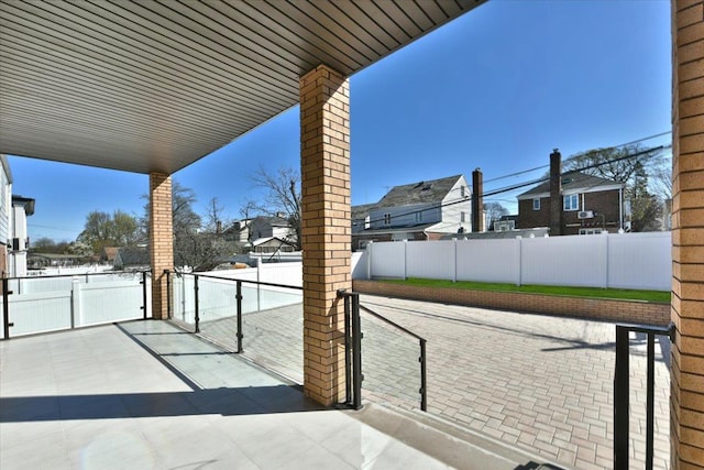 76-47 173rd St, Fresh Meadows, NY 11366 - view of patio with a residential view, fence, and a gate