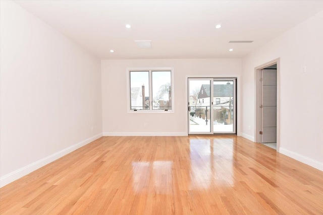 76-47 173rd St, Fresh Meadows, NY 11366 - empty room with recessed lighting, light wood finished floors, and baseboards