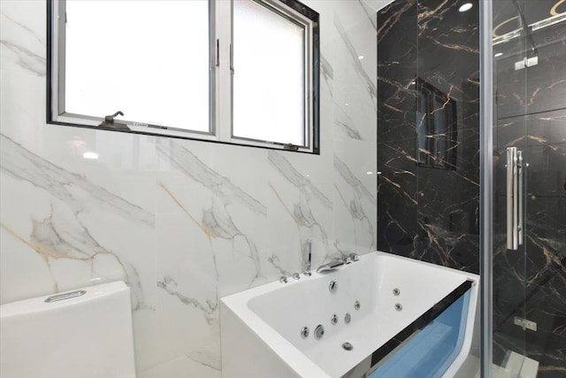 76-47 173rd St, Fresh Meadows, NY 11366 - full bathroom with a whirlpool tub, a marble finish shower, and tile walls