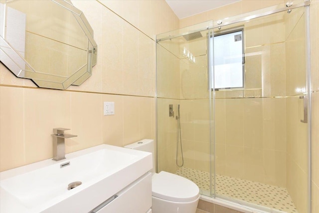 76-47 173rd St, Fresh Meadows, NY 11366 - full bathroom with a shower stall, vanity, tile walls, and toilet
