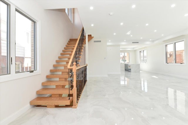 76-47 173rd St, Fresh Meadows, NY 11366 - staircase featuring visible vents, baseboards, and marble finish floor
