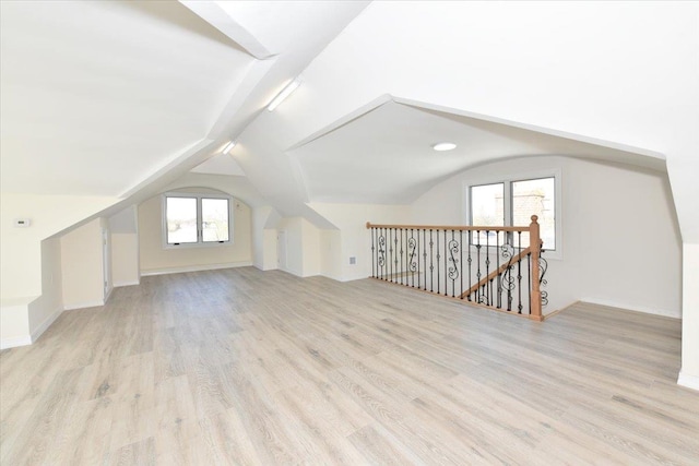 76-47 173rd St, Fresh Meadows, NY 11366 - additional living space with baseboards, lofted ceiling, and light wood-style flooring