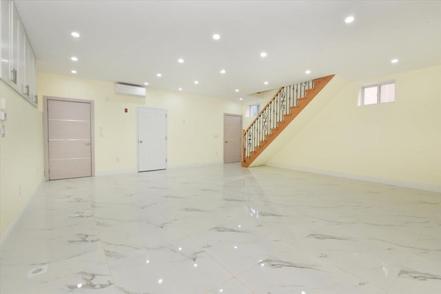 76-47 173rd St, Fresh Meadows, NY 11366 - interior space with recessed lighting, a wall mounted AC, baseboards, and stairs