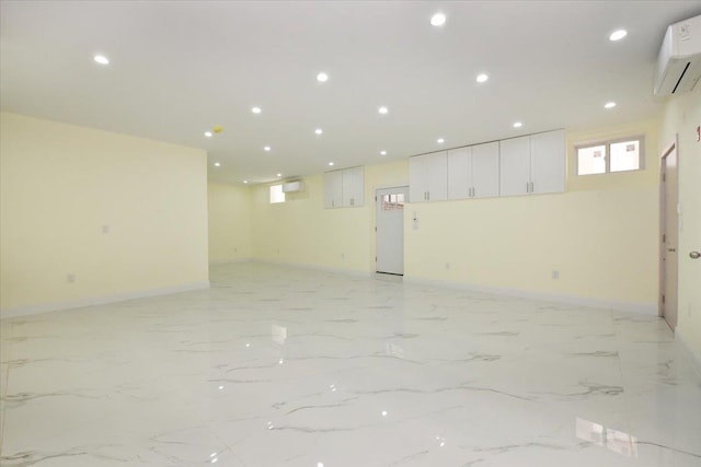 76-47 173rd St, Fresh Meadows, NY 11366 - below grade area featuring a wall mounted air conditioner, baseboards, and recessed lighting