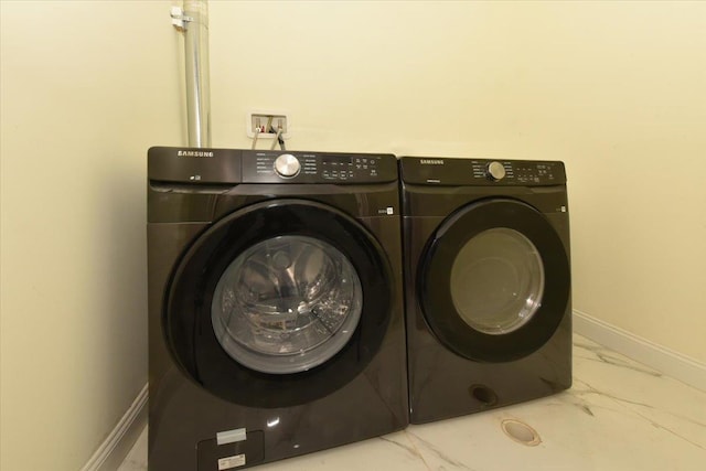 76-47 173rd St, Fresh Meadows, NY 11366 - washroom with washer and dryer, marble finish floor, laundry area, and baseboards