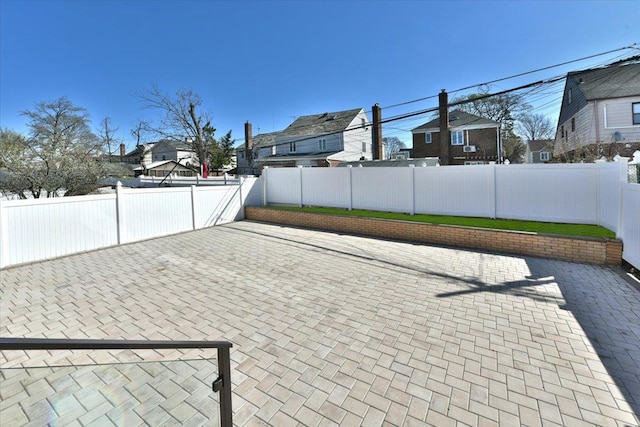 76-47 173rd St, Fresh Meadows, NY 11366 - view of patio with a fenced backyard and a residential view