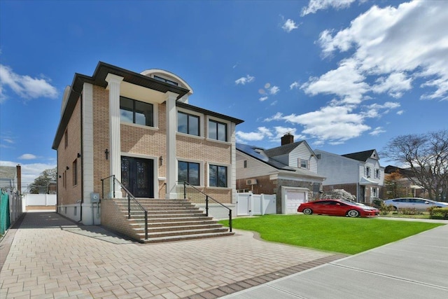 76-47 173rd St, Fresh Meadows, NY 11366 - view of front of home featuring brick siding, fence, and a front yard