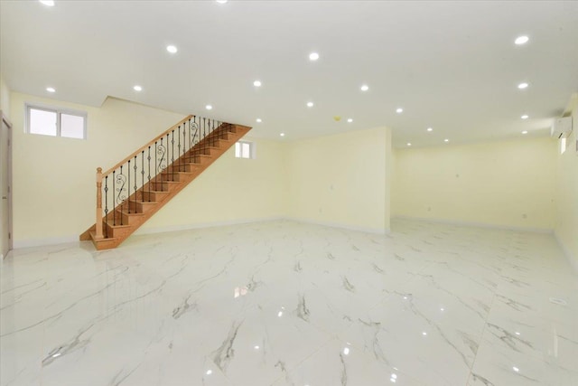 76-47 173rd St, Fresh Meadows, NY 11366 - basement featuring a wall mounted air conditioner, recessed lighting, stairway, and baseboards