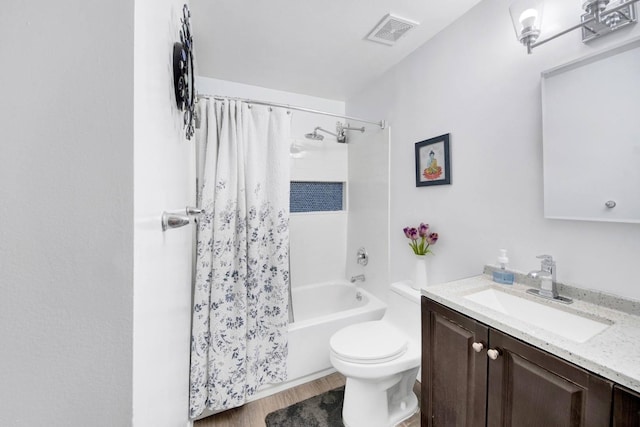 full bath featuring visible vents, vanity, wood finished floors, shower / bath combination with curtain, and toilet