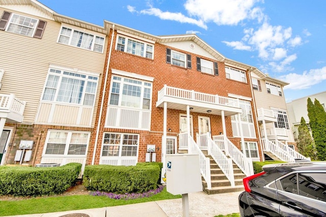view of property with brick siding