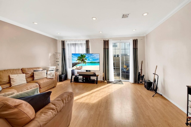 living area featuring crown molding, recessed lighting, and light wood-style flooring