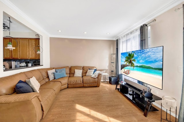 living area featuring recessed lighting, ornamental molding, and light wood finished floors
